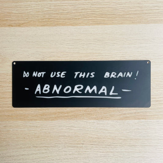 Targa in plexiglass "AB NORMAL"